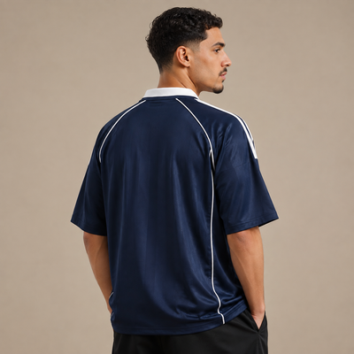 Navy piped Djazaïr jersey worn three-quarter view, white piping