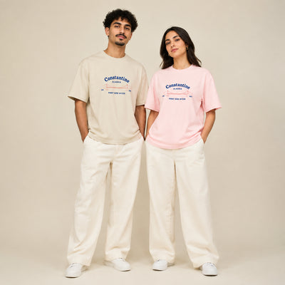 T-shirts Constantine blanc et rose portés par un homme et une femme