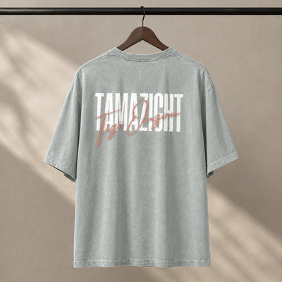 T-shirt Tamazight vert délavé présenté sur cintre