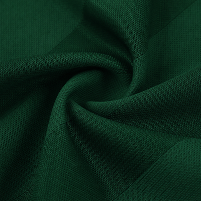 Close-up of the green technical mesh of the piped Djazaïr jersey