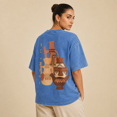 T-shirt Amazigh bleu délavé avec design inspiré de l’artisanat amazigh imprimé au dos